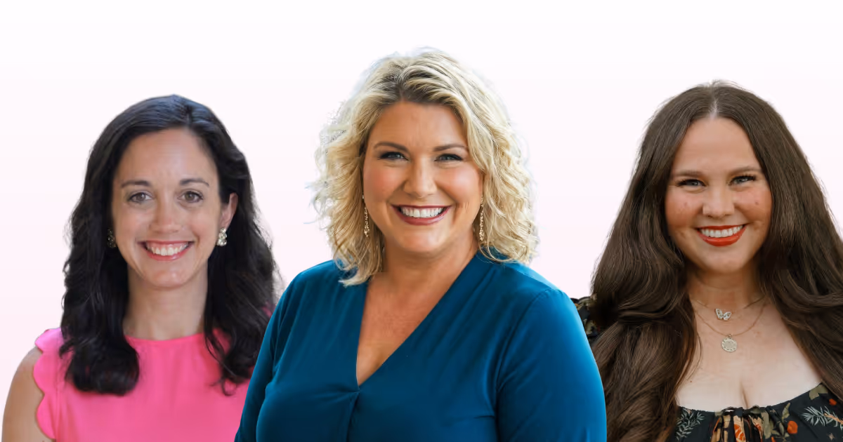 Three smiling women with different hair colors and styles, wearing colorful tops against a white background.
