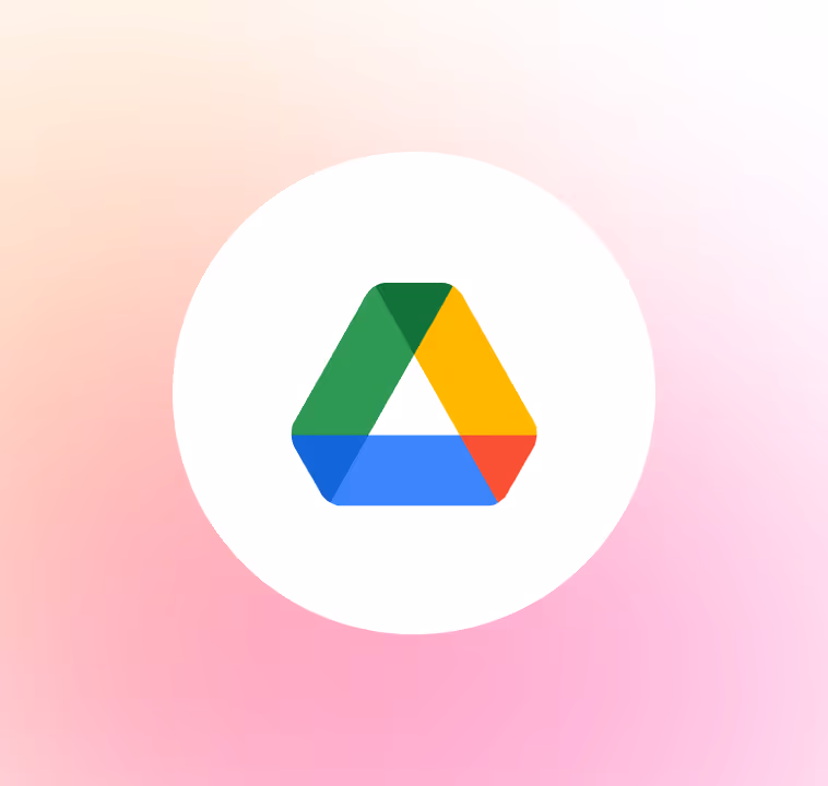 Google Drive logo with green, yellow, blue, and red triangular shapes on a white circle and pink gradient background.