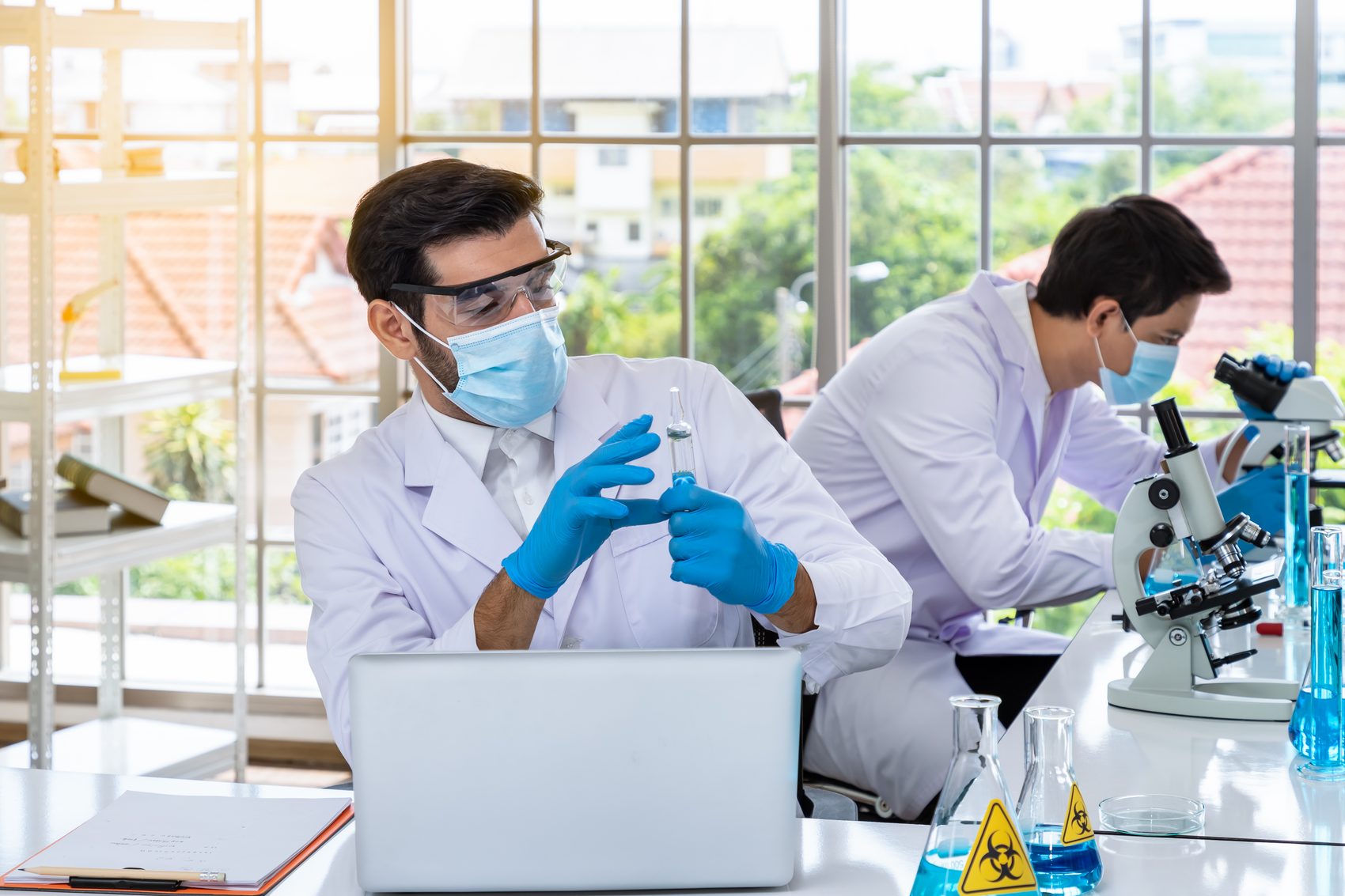 Researchers working with laboratory equipment