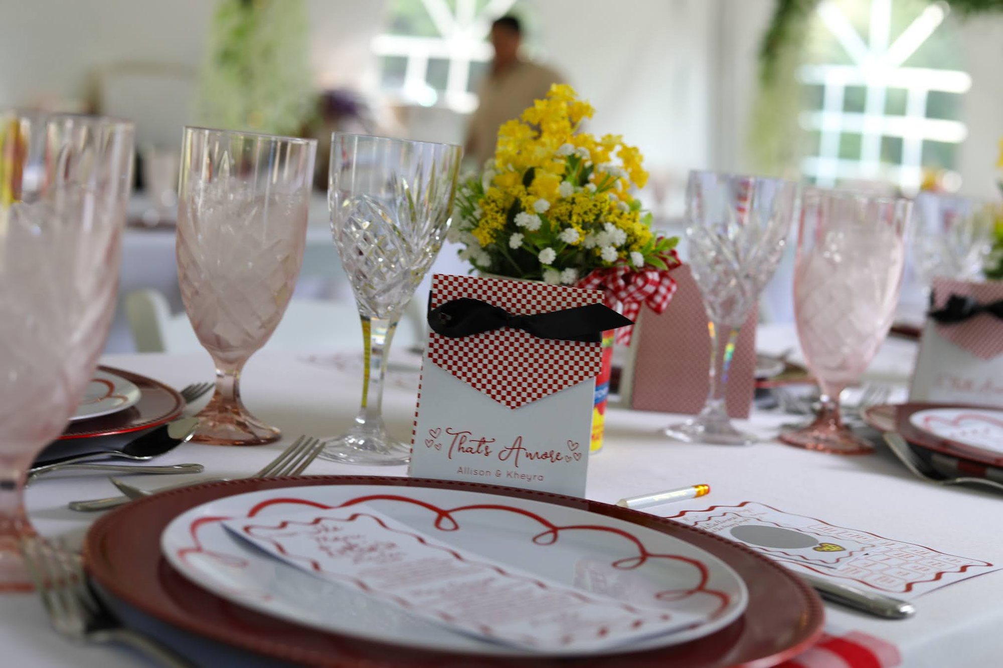 Gingham table setting at a That's Amore themed event
