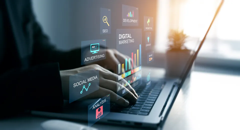 Laptop with digital marketing icons for SEO, advertising, and social media.