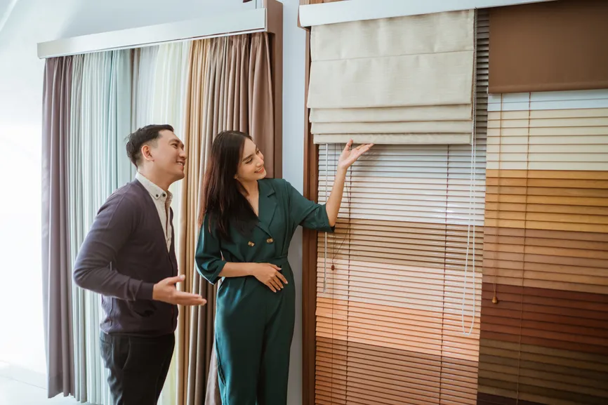 Couple choosing window treatments