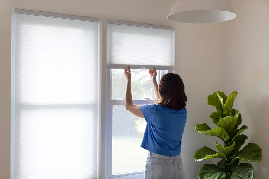 Cellular shades being raised