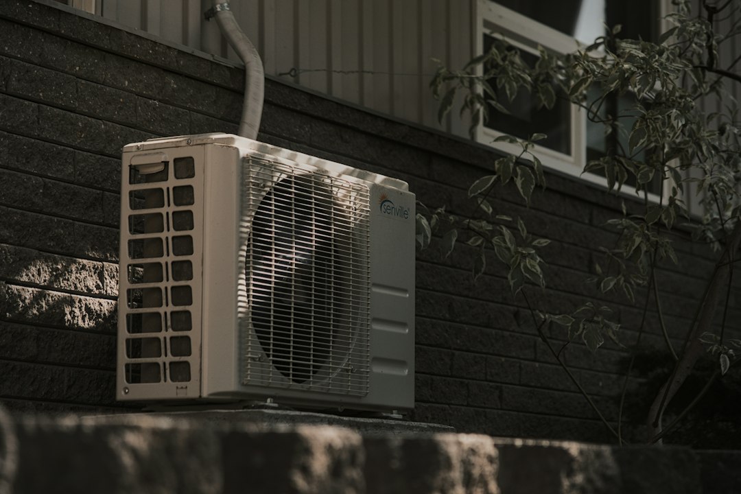 AC replacement unit installed outside a Wichita home in summer heat - ac replacement in wichita ks