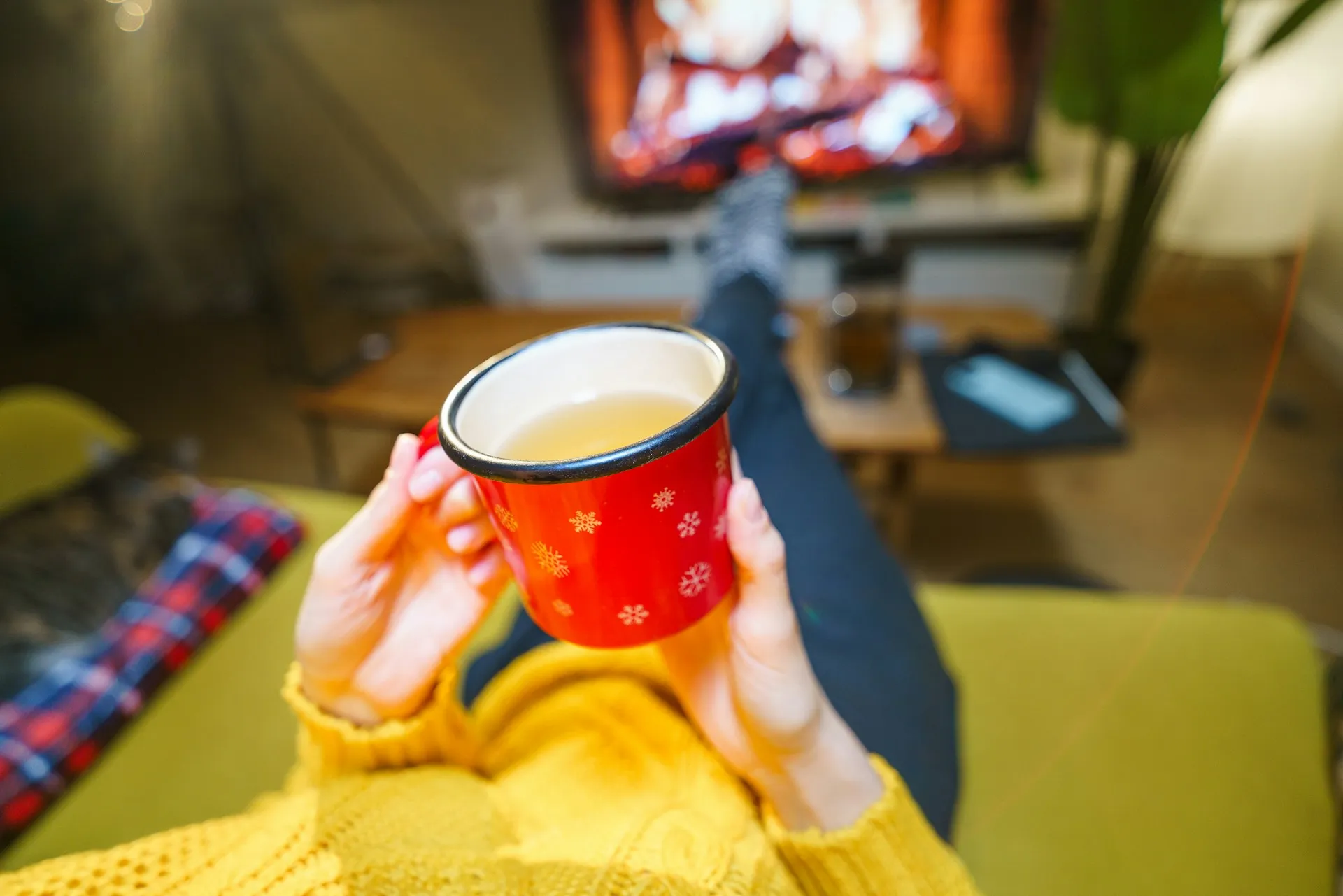 Person relaxing with a hot drink