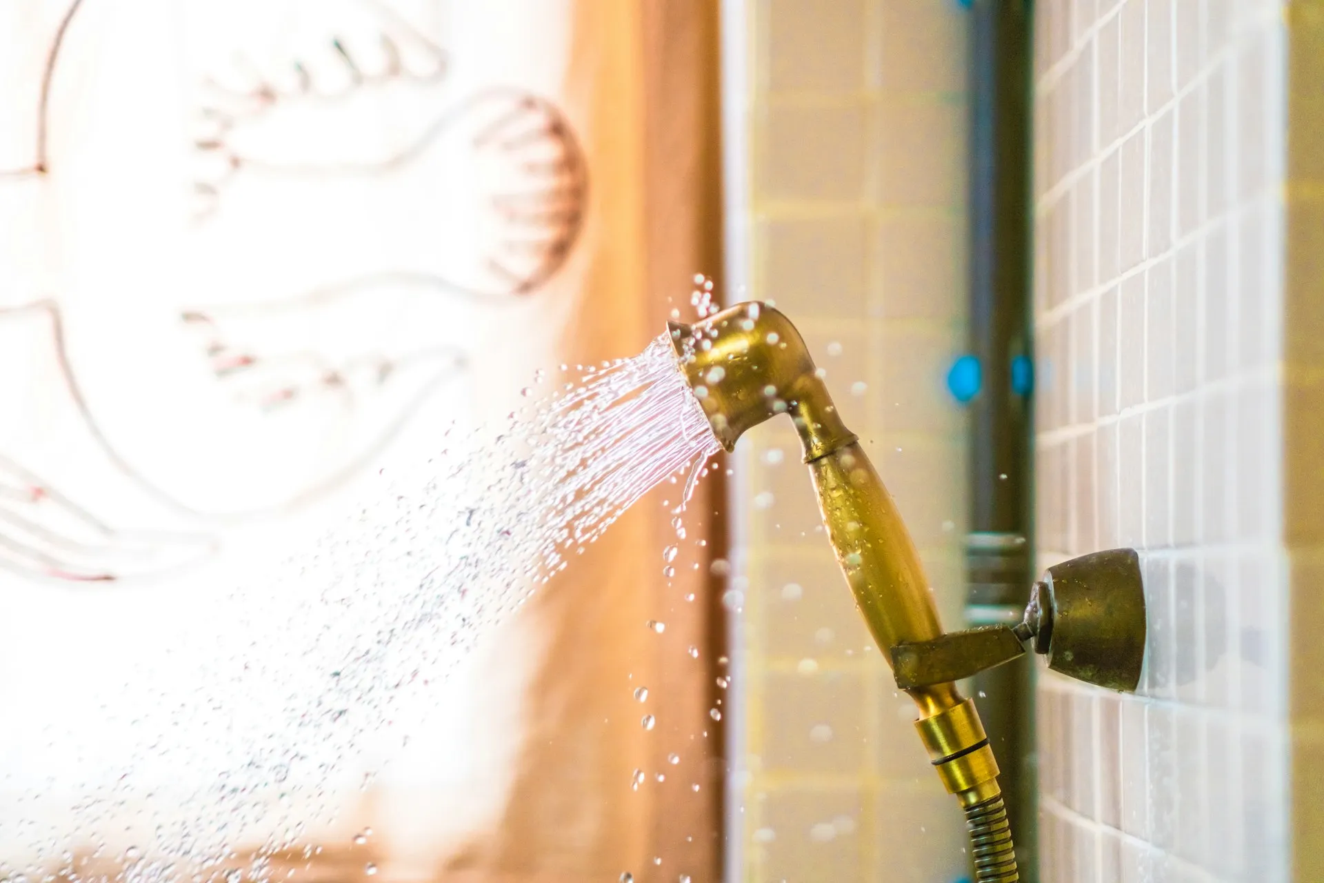 Gold shower head spraying water