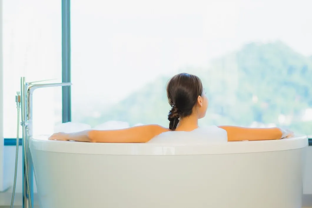 Woman taking a relaxing bath.