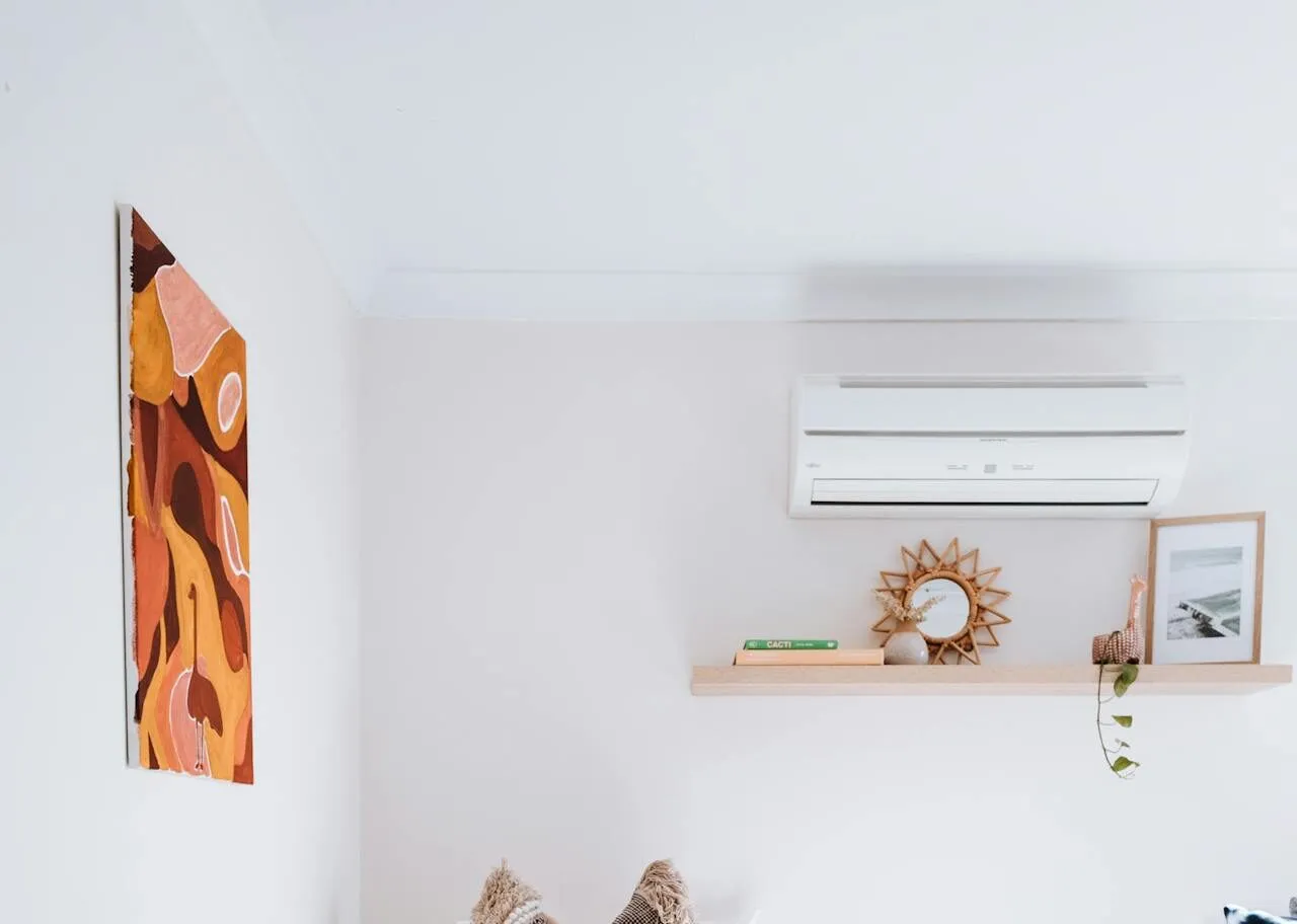 White indoor AC unit mounted on wall.