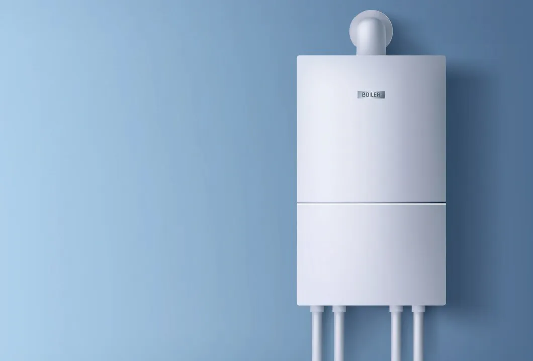 White boiler on a blue wall.
