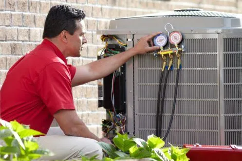 Man repairing an AC unit.