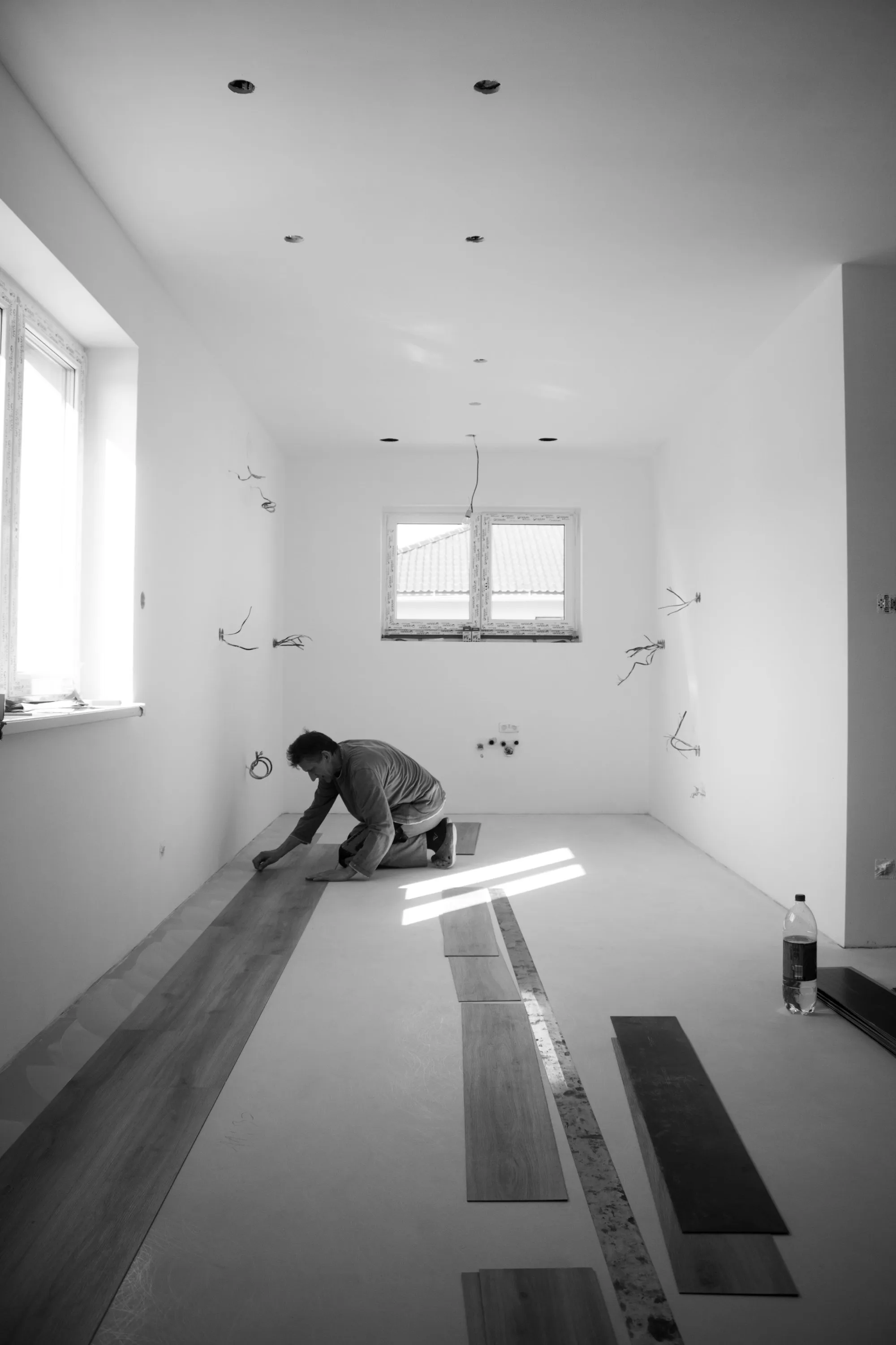 Installer laying luxury vinyl plank