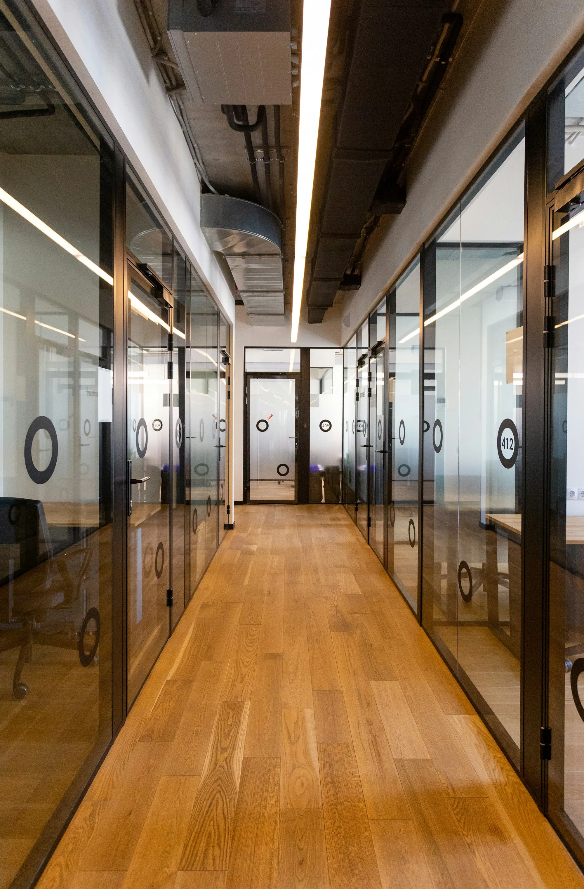 Commercial office corridor with wood flooring