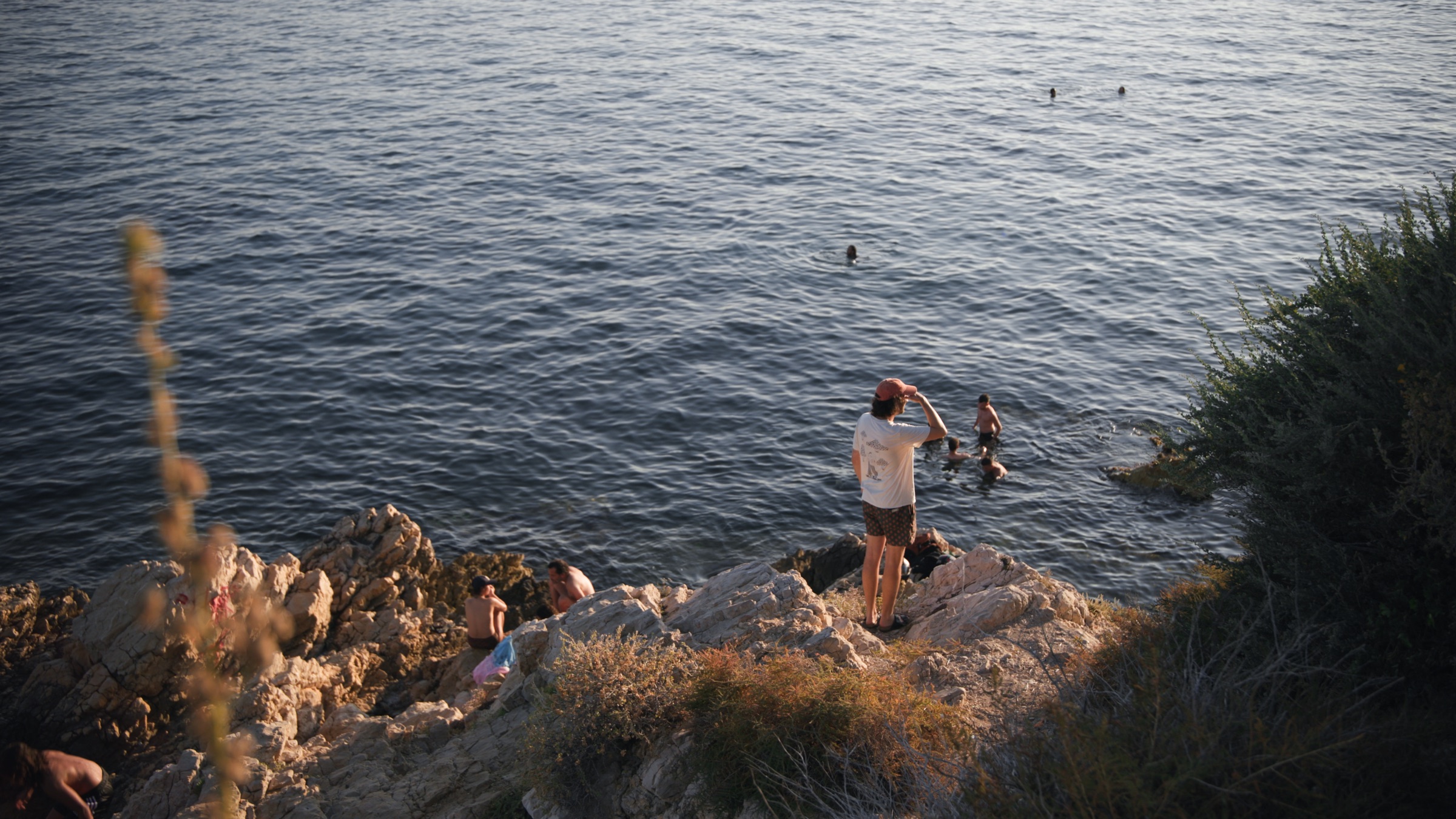 Swimmers on the rocks by the sea in Marseille, from My City, My Backyard