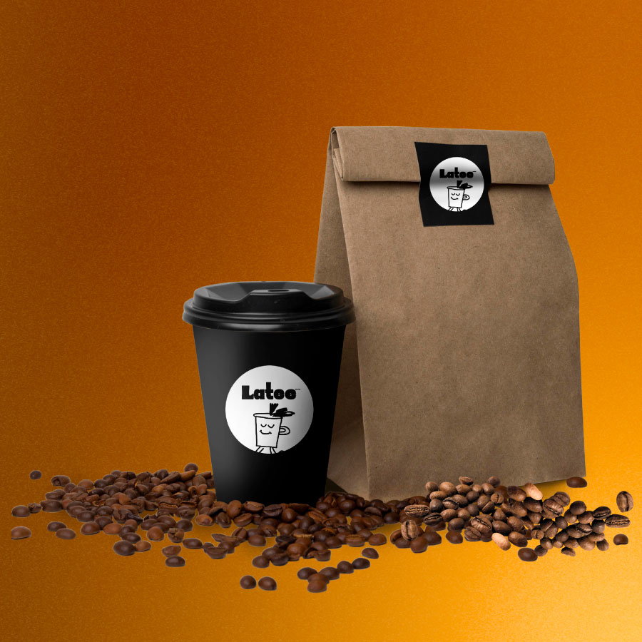 A black takeaway coffee cup and a brown paper bag surrounded by scattered coffee beans on an orange background; both the cup and bag have a white circular logo featuring a smiling coffee cup character and the word 'Latee'.