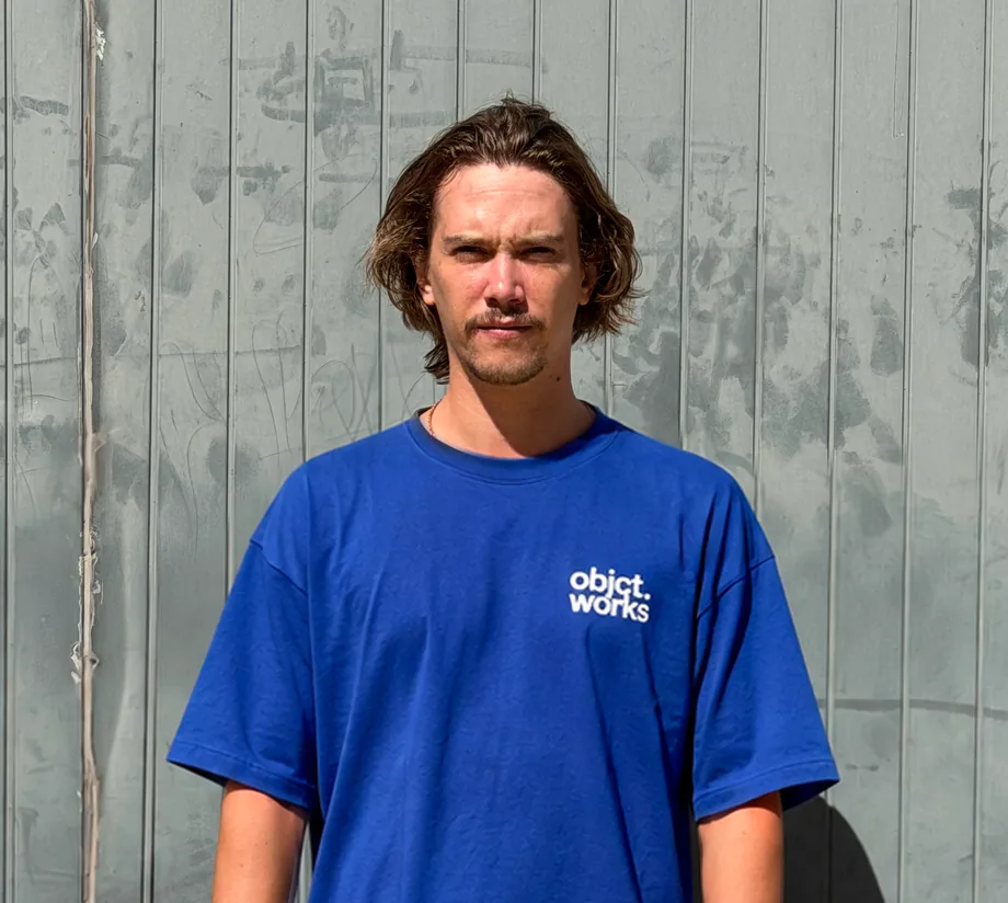 Man wearing a branded blue T-shirt
