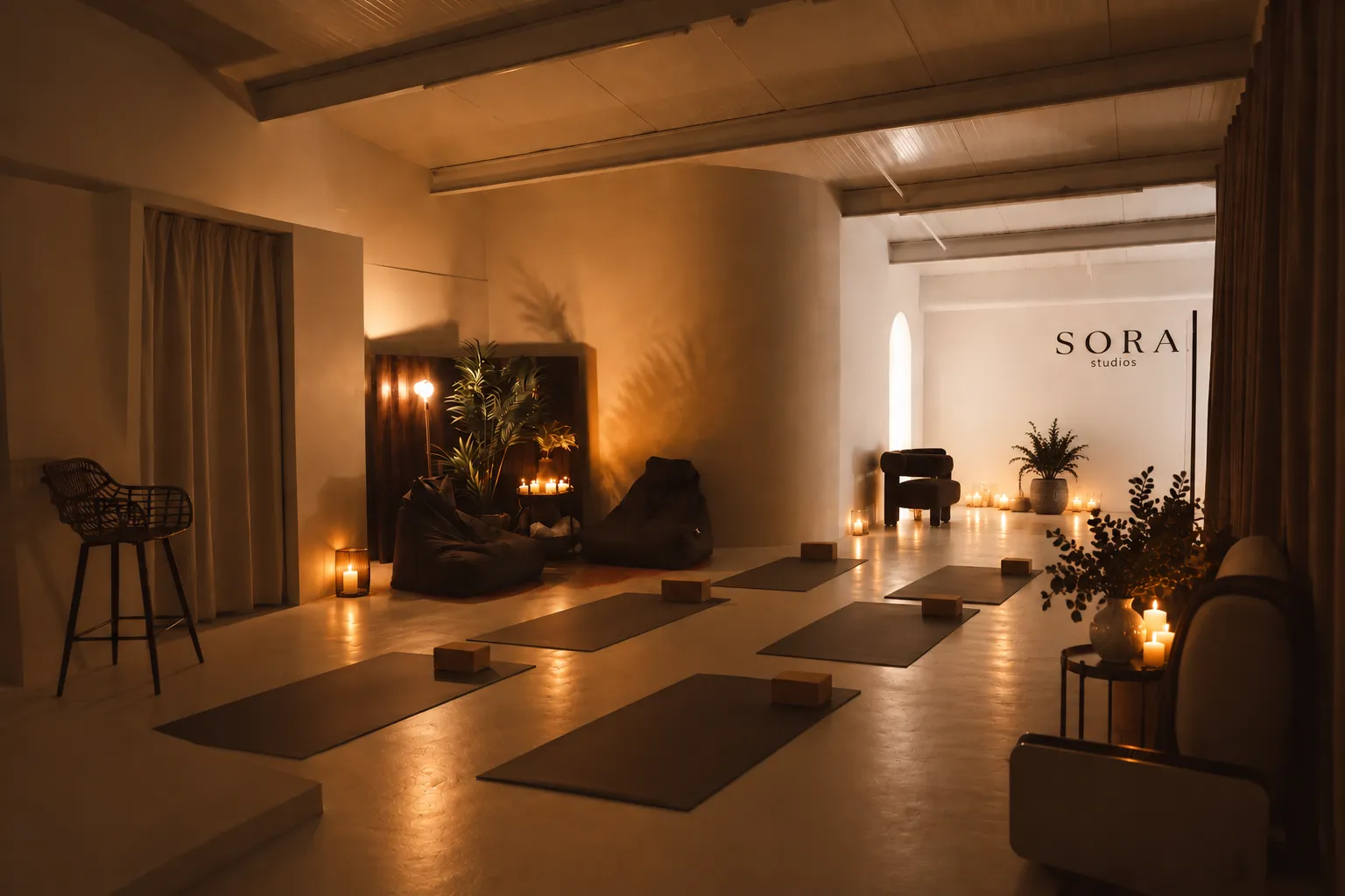 Sora Studios set up for a yoga workshop with mats, bolsters and candlelight