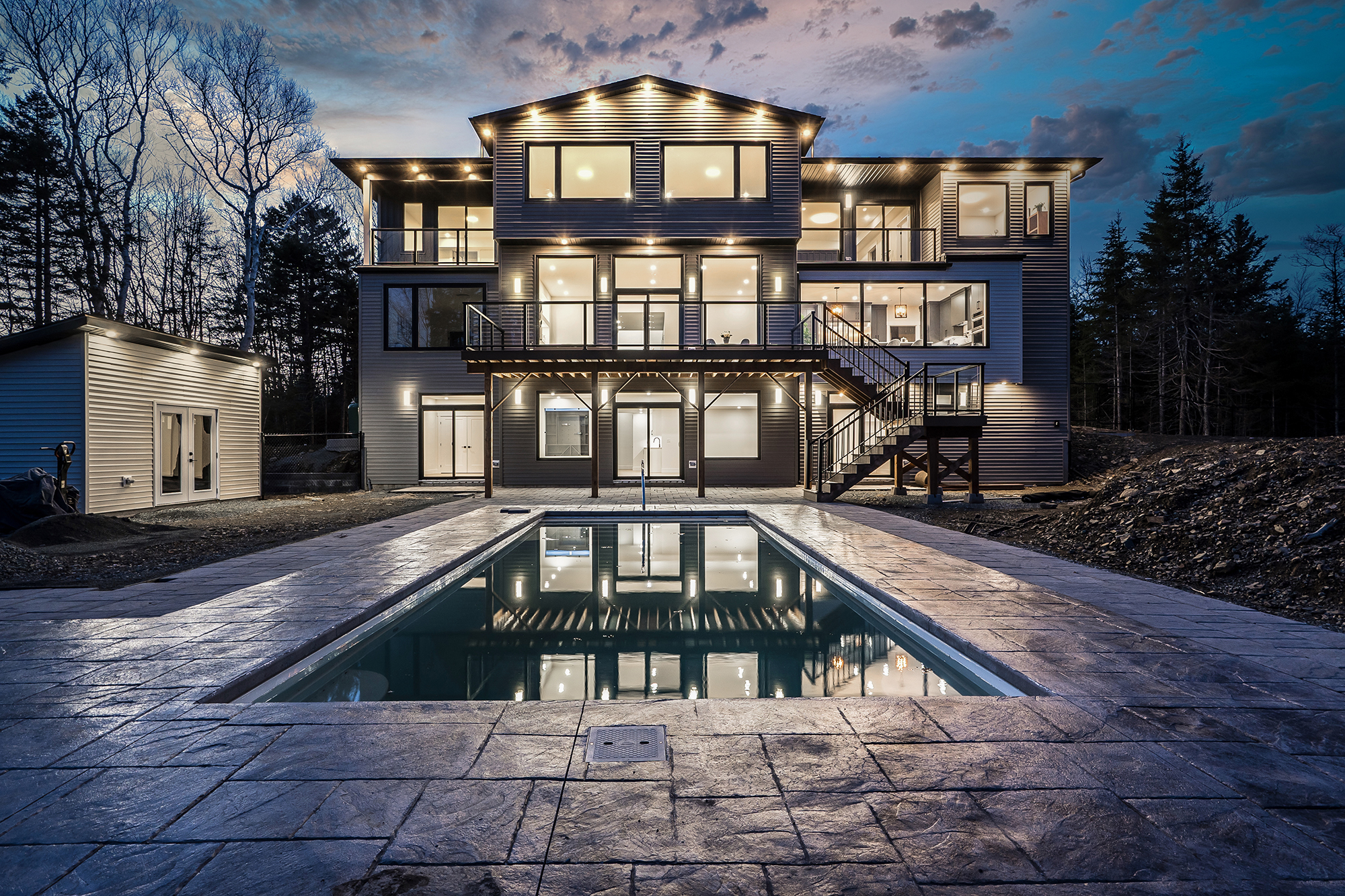 Luxury home with pool at twilight, real twilight photography by Newlife Studio, Halifax