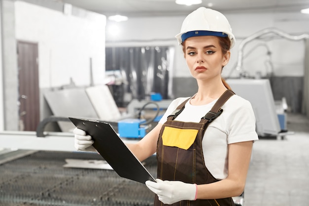 Young engineer on a metal factory floor