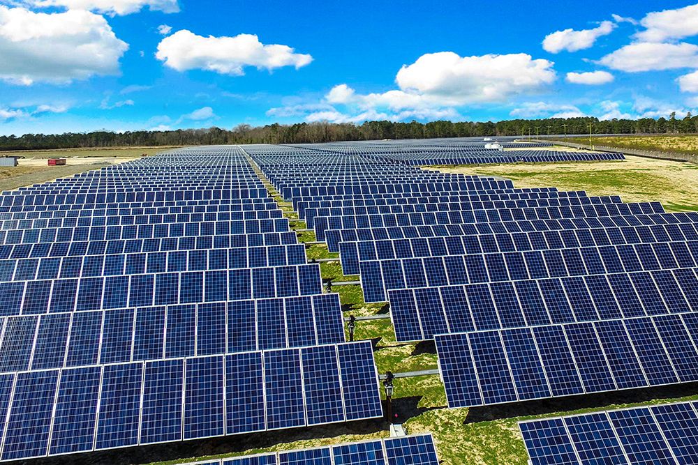 Aerial view of an industrial roof covered in solar panels