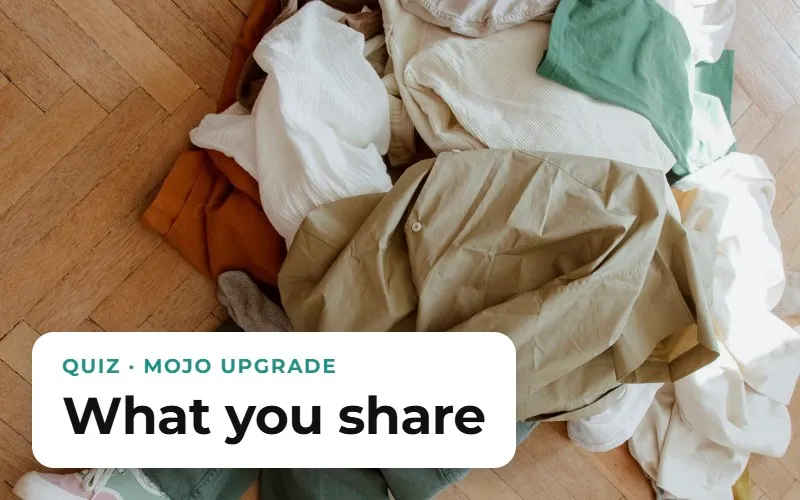 Clothes left in a heap on a wooden floor