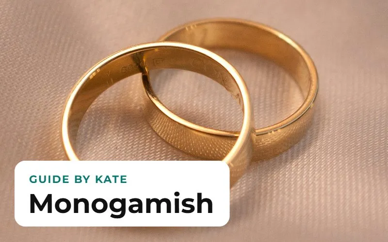 Two gold wedding rings resting on fabric