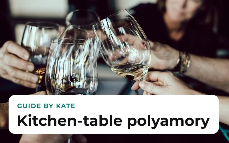 Several hands raising wine glasses over a shared table