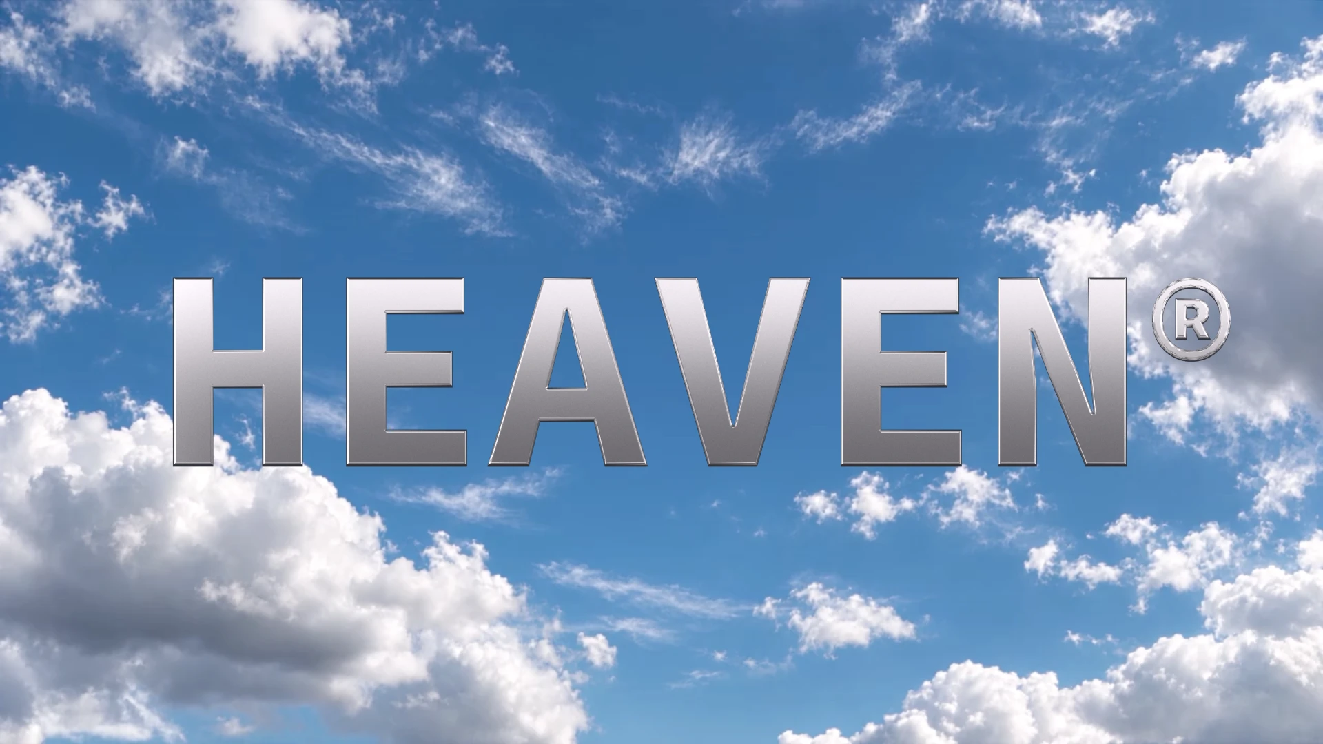 The original HEAVEN logo in brushed silver chrome against a blue sky