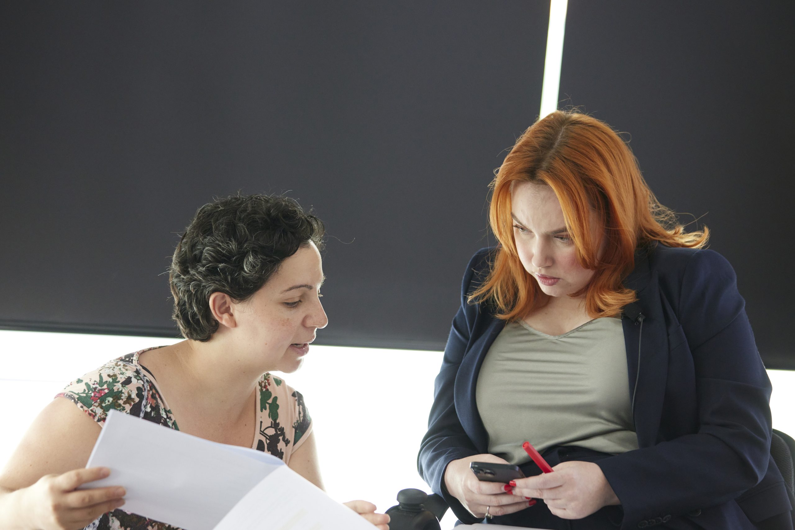 Image of two women in conversation.