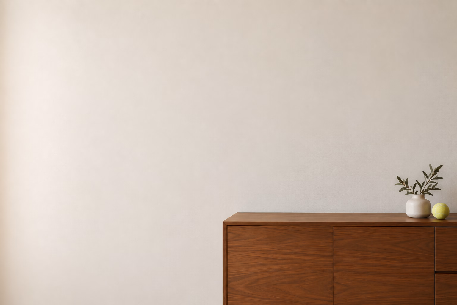 Living room wall above a wooden credenza