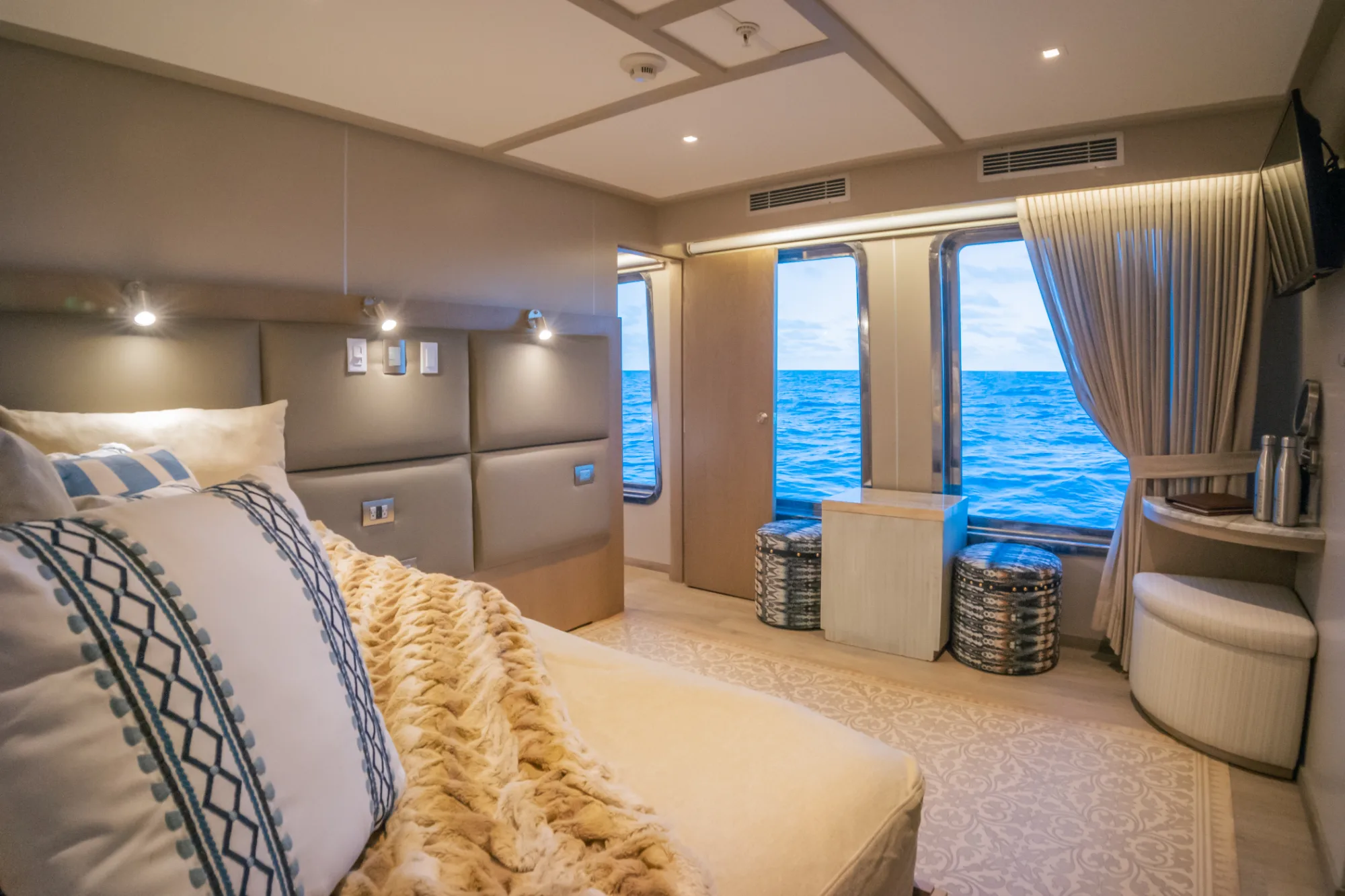 Premium suite with a living area and oceanfront windows