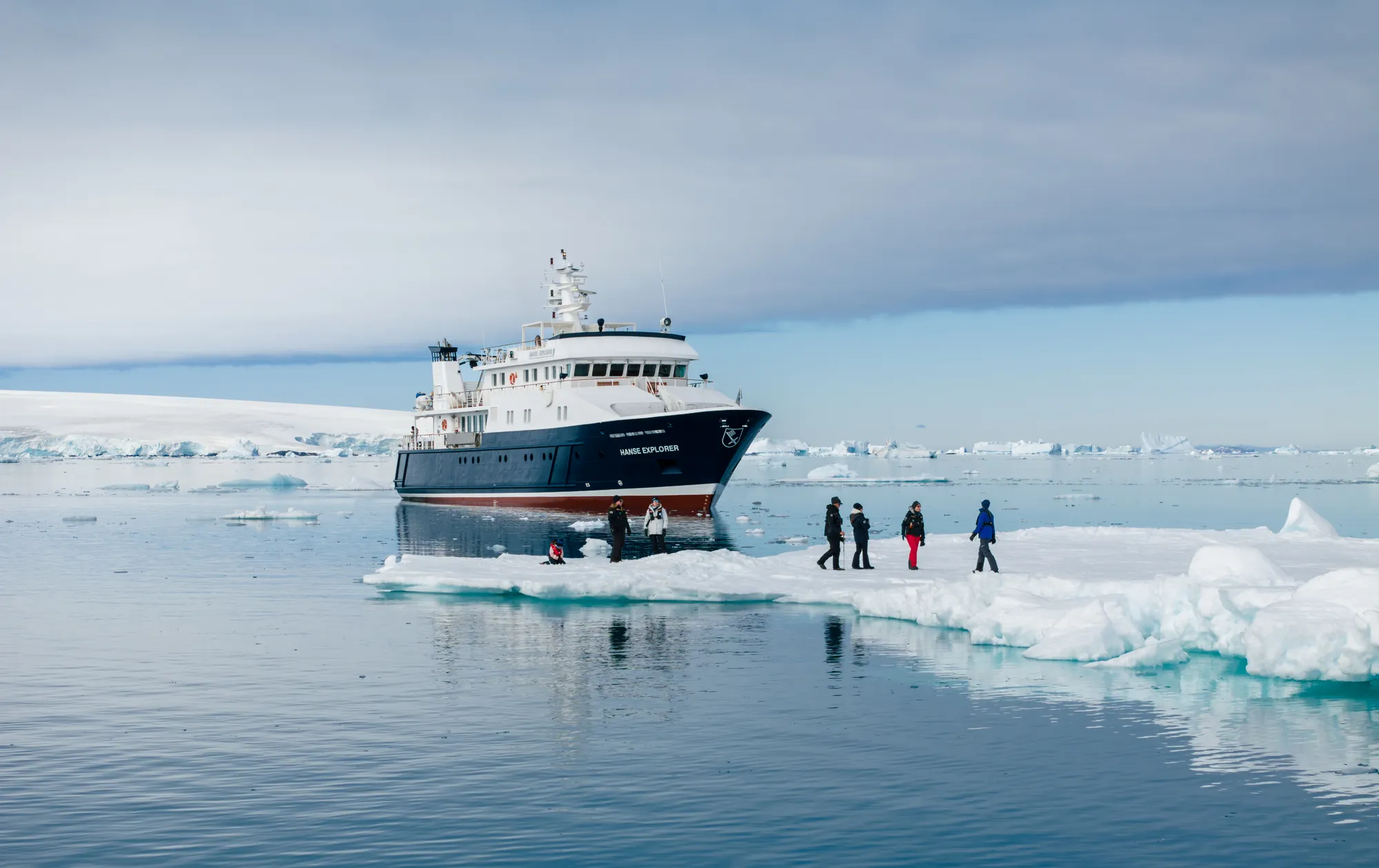 Hanse Explorer expedition yacht at anchor along a remote coastline