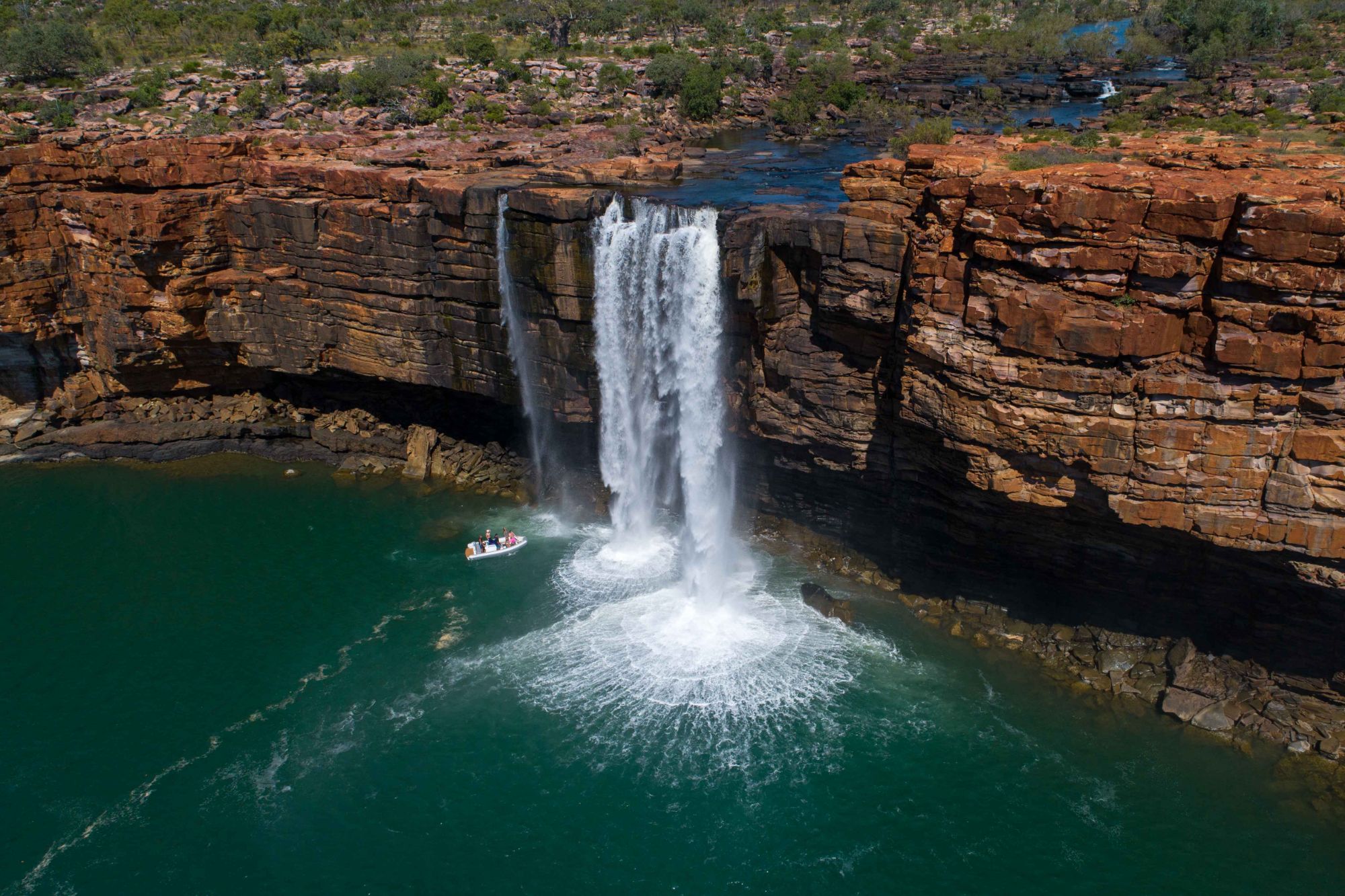 Red sandstone cliffs and waterfall in the Kimberley