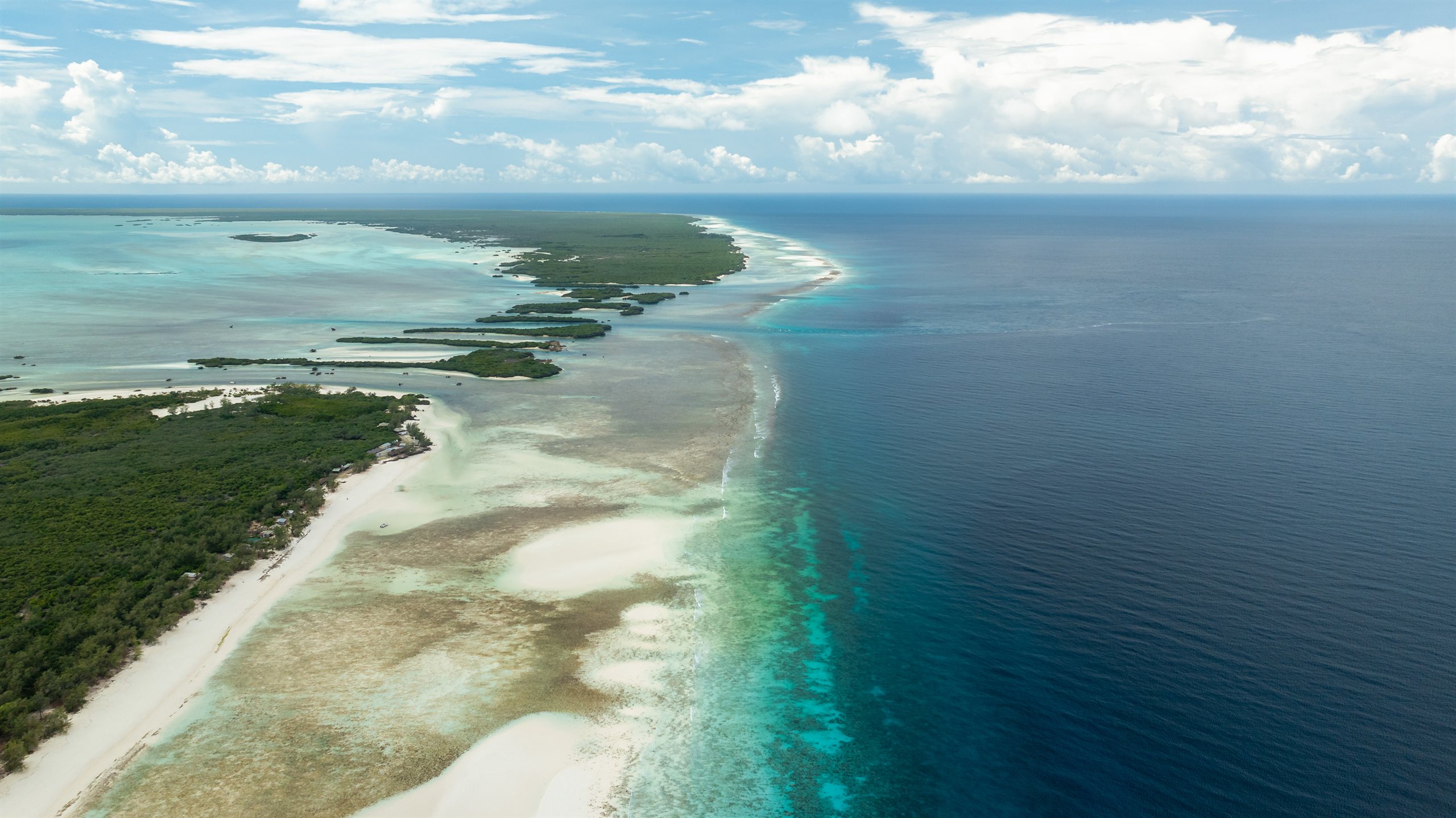 Aerial view of an outer Seychelles atoll coastline and lagoon