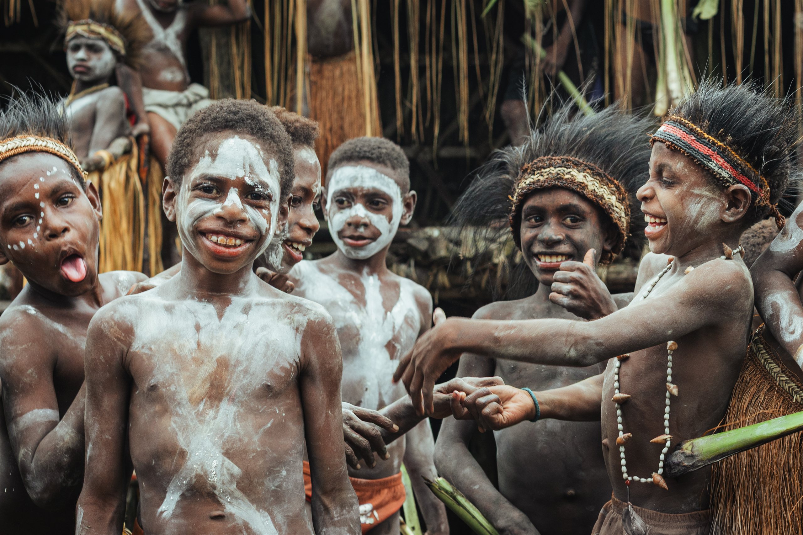 Asmat children welcoming guests in their village