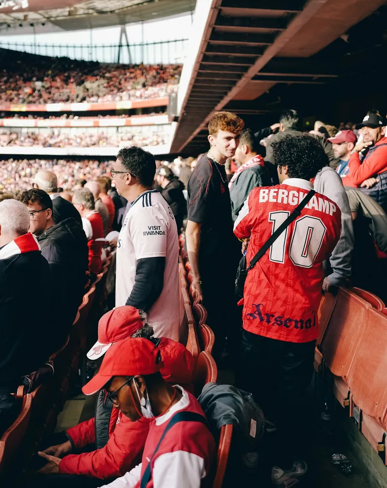 Football fans in the stands of a stadium