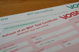 Top of MOT certificate with a pair of car keys