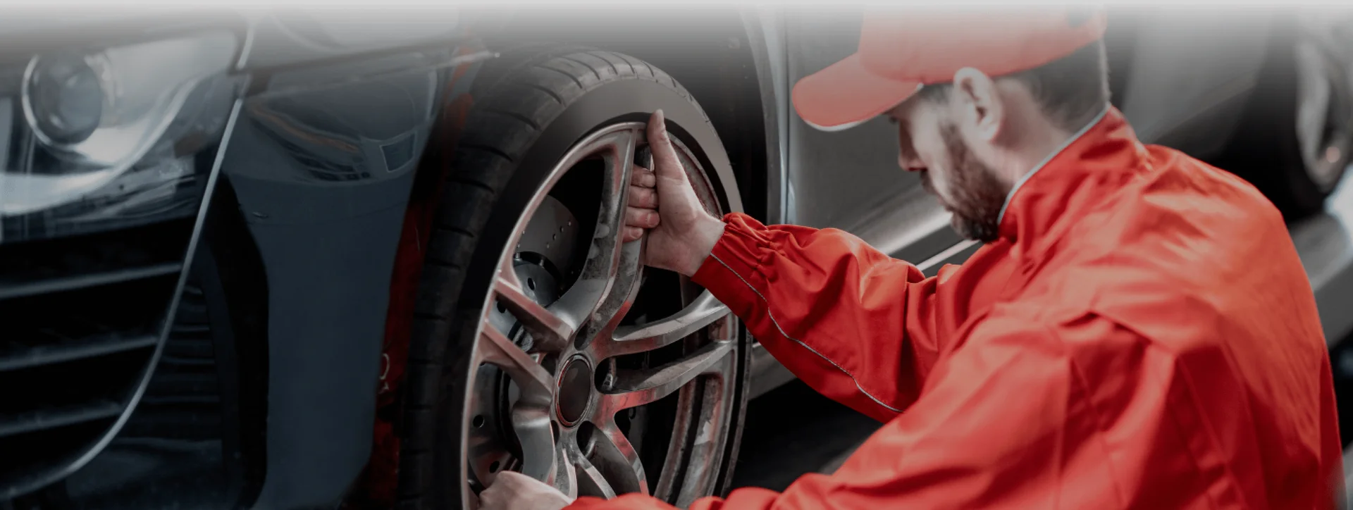 Man checking car tyres