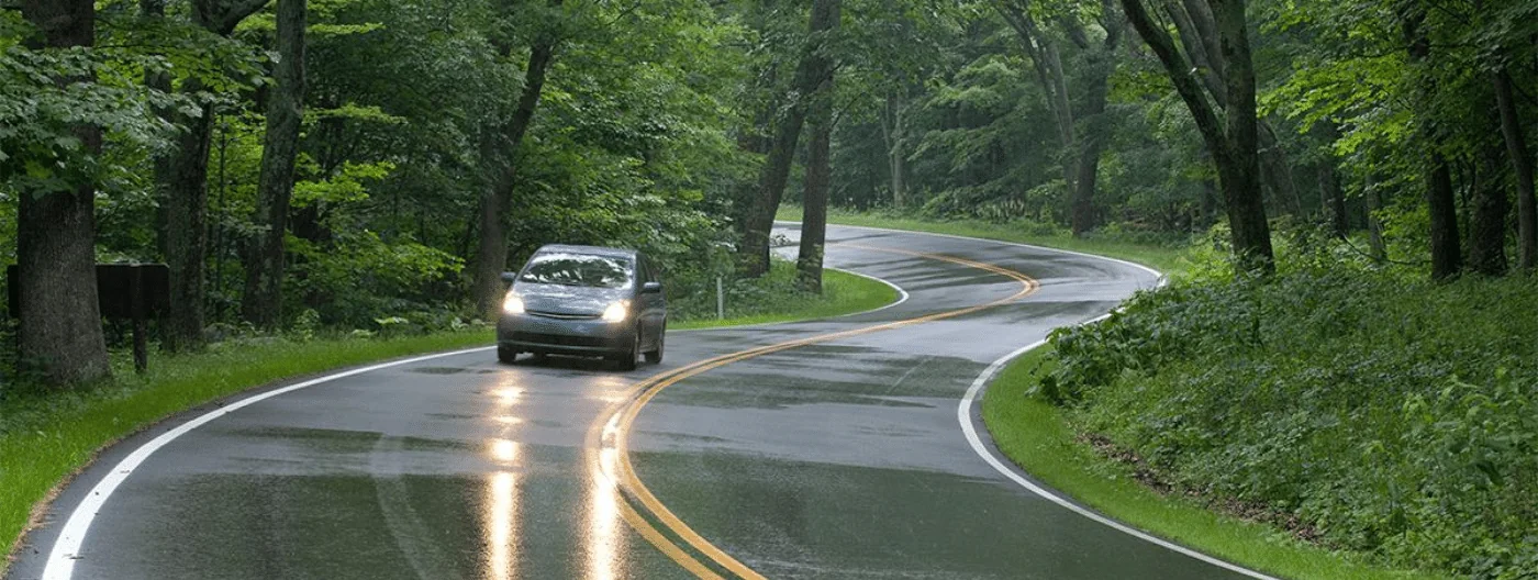 car driving on wet slippery road