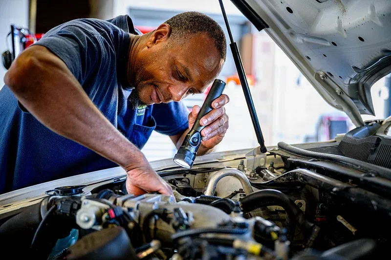 mechanic fixing a car