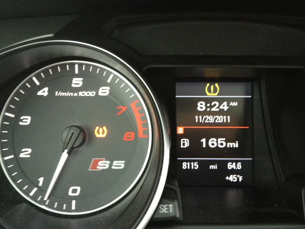 Main checking tyre pressure using a tyre pressure gauge