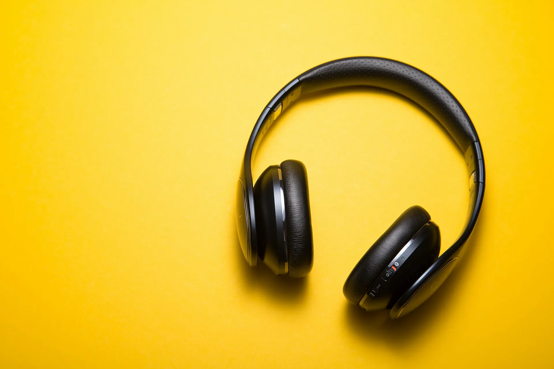 Pair of headphones on a plain background