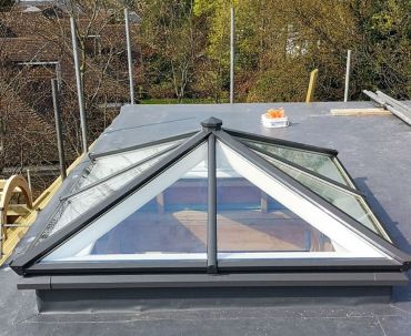 Square roof lantern with slate grey cappings