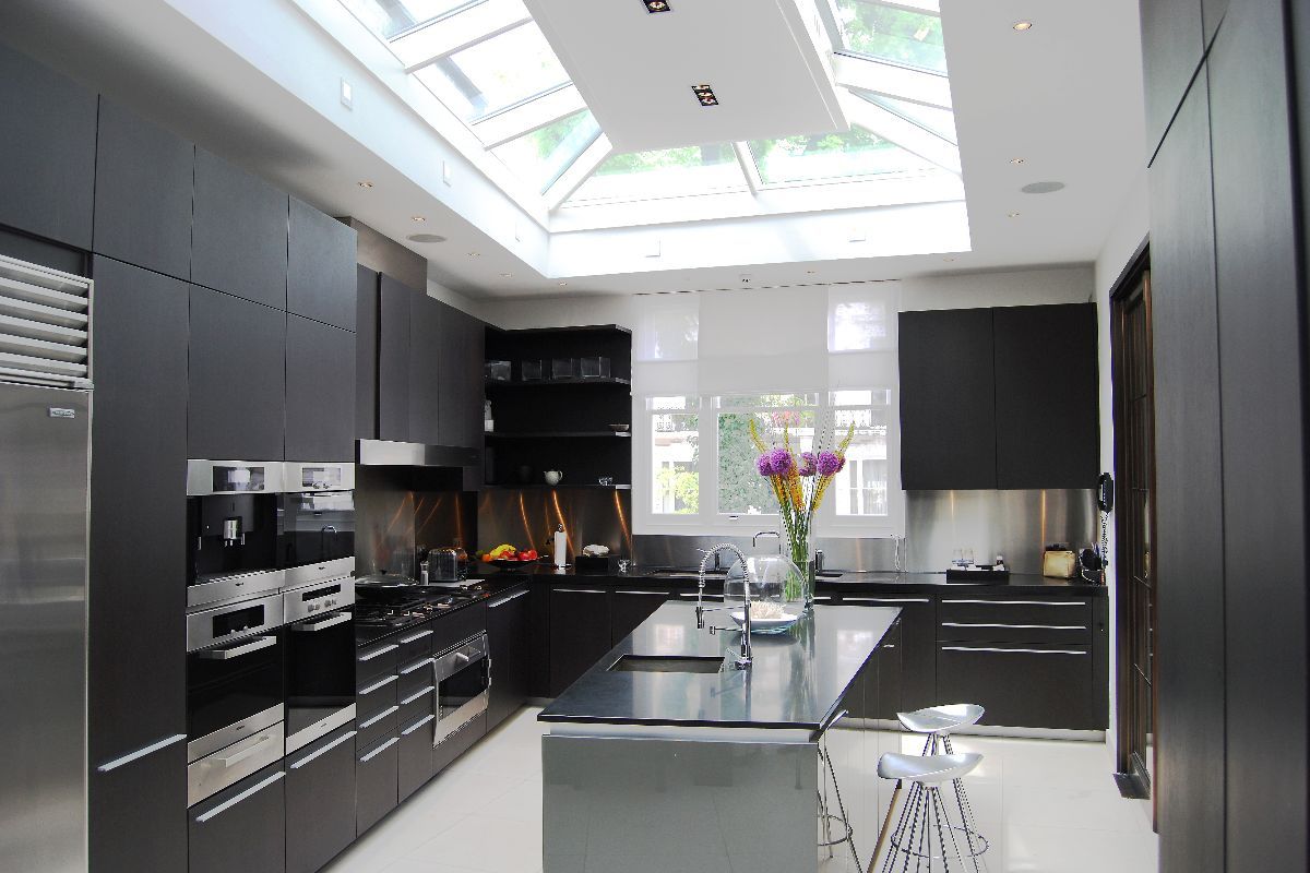 Bespoke wedge-shaped roof lantern with central flat roof section