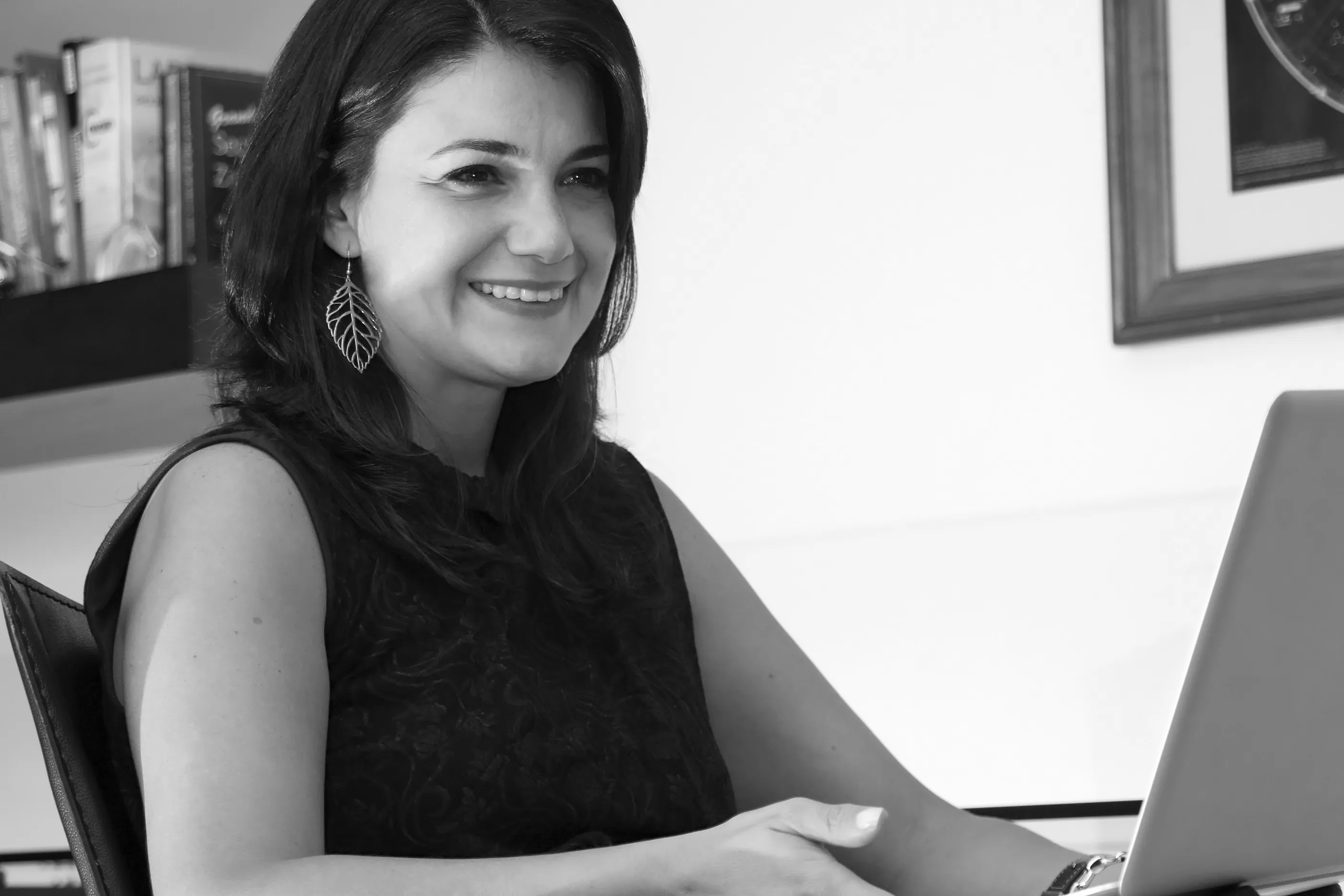 Smiling professional working at a computer
