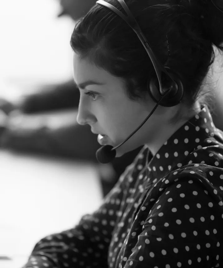 Customer support representative wearing a headset