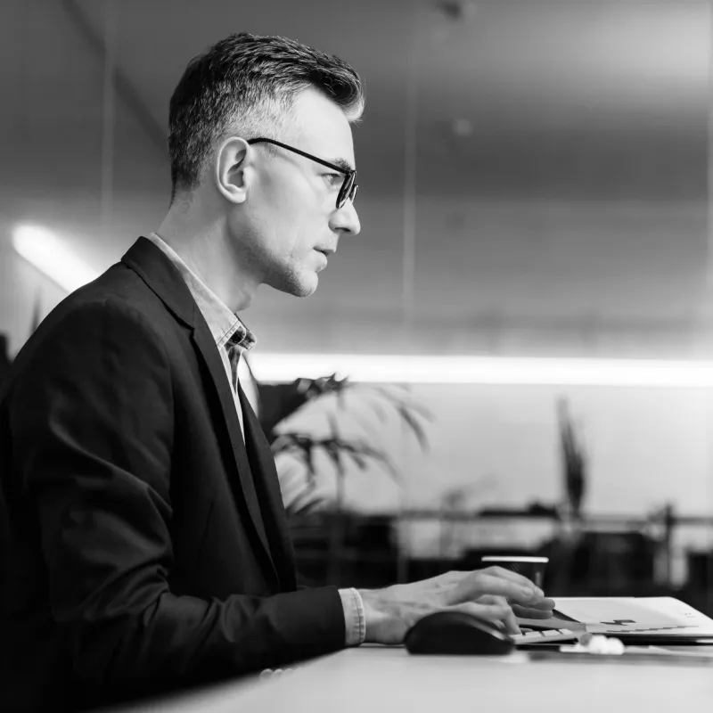 Operations specialist configuring benefits at a workstation
