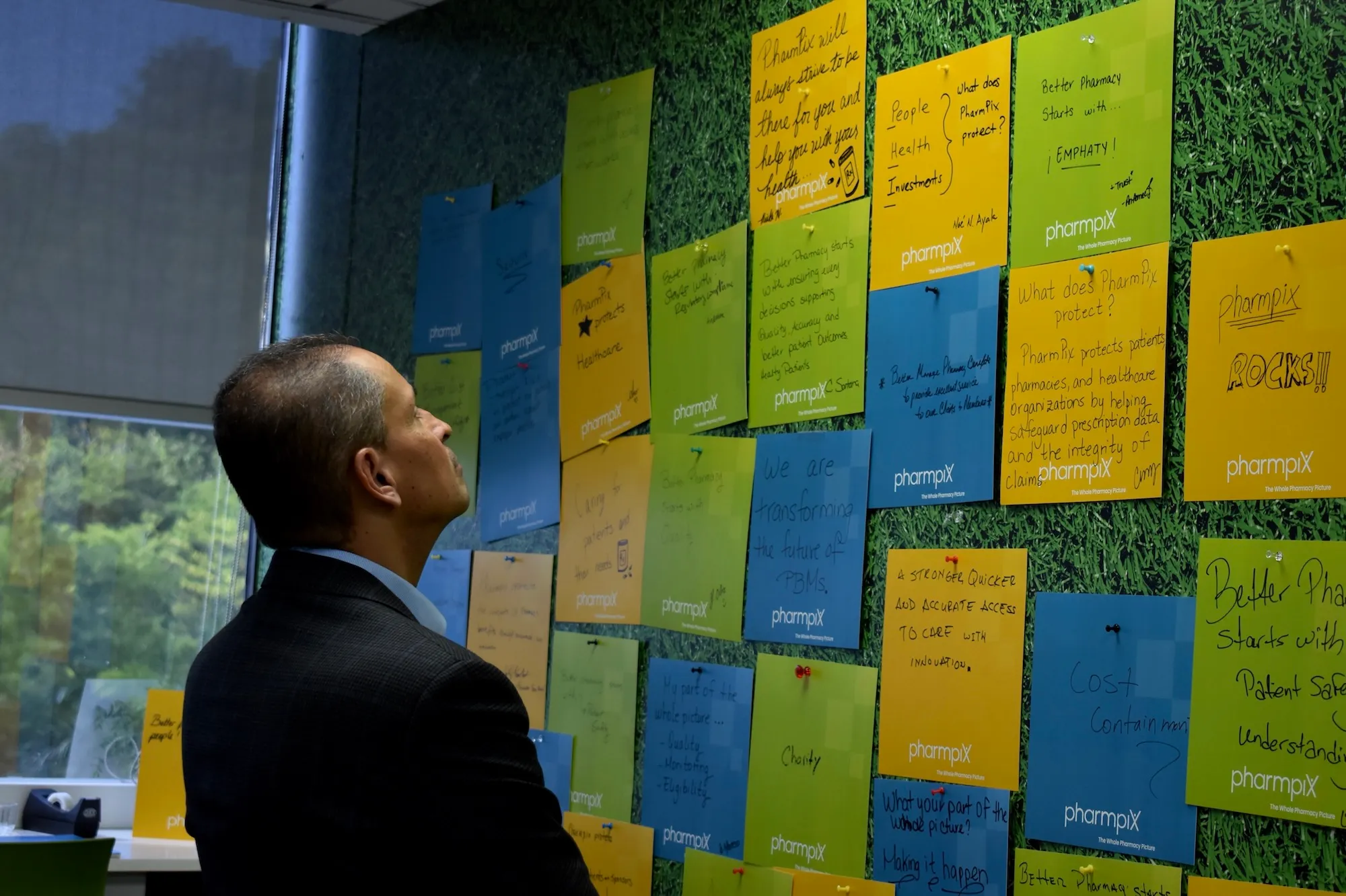 Martty Martinez looking at wall of messages.