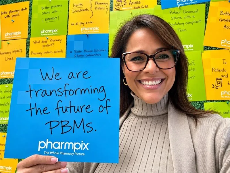 Woman holding sign that says - We are transforming the future of PBMs.