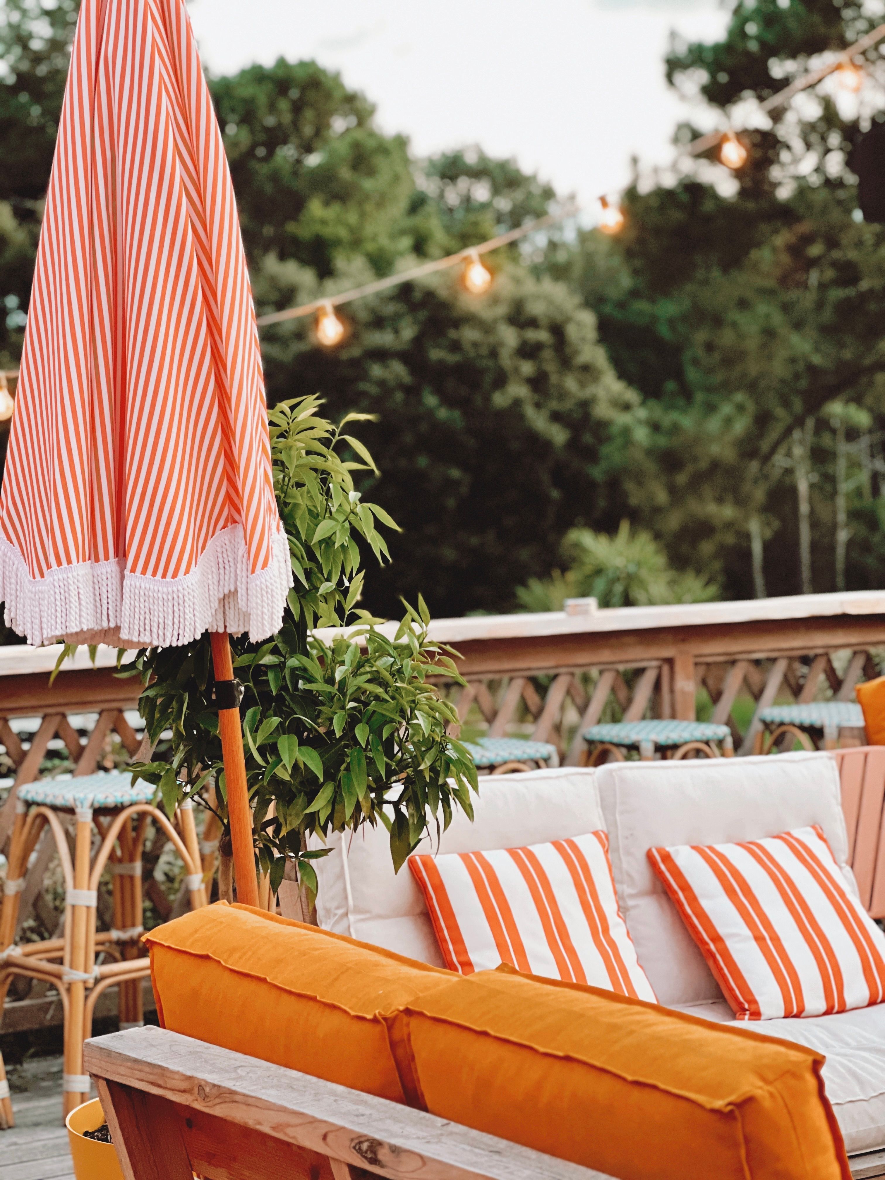 Patio with orange pillows 