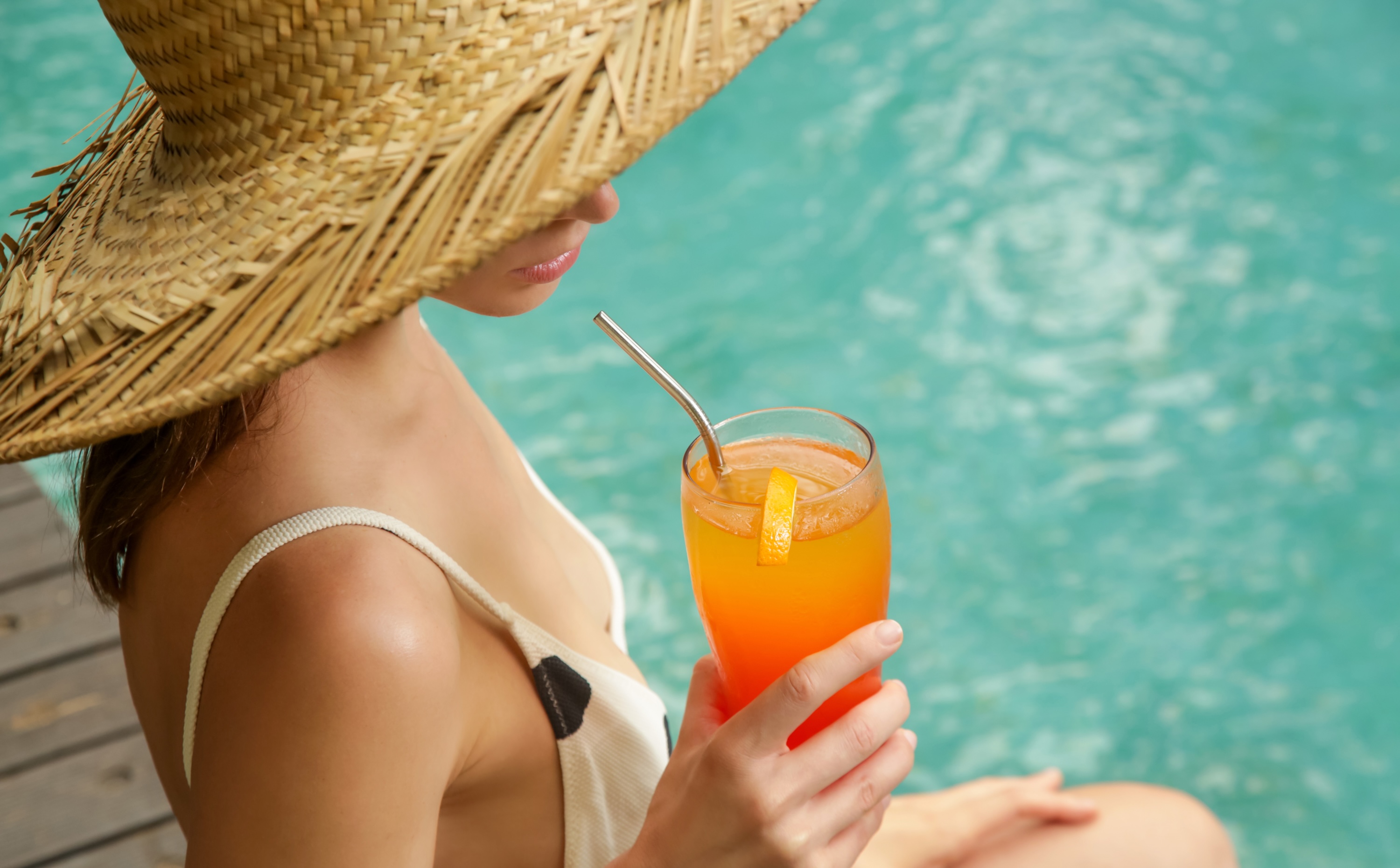 Person in pool with drink stock image